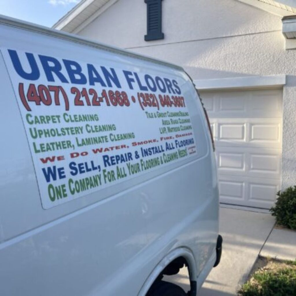 A service van labeled "Urban Floors," specializing in Carpet Cleaning In Clermont.