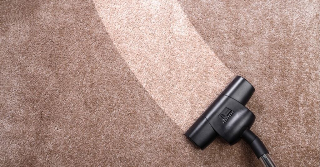 Urban Floors explaining common carpet cleaning myths in a Clermont home with visible traffic lanes