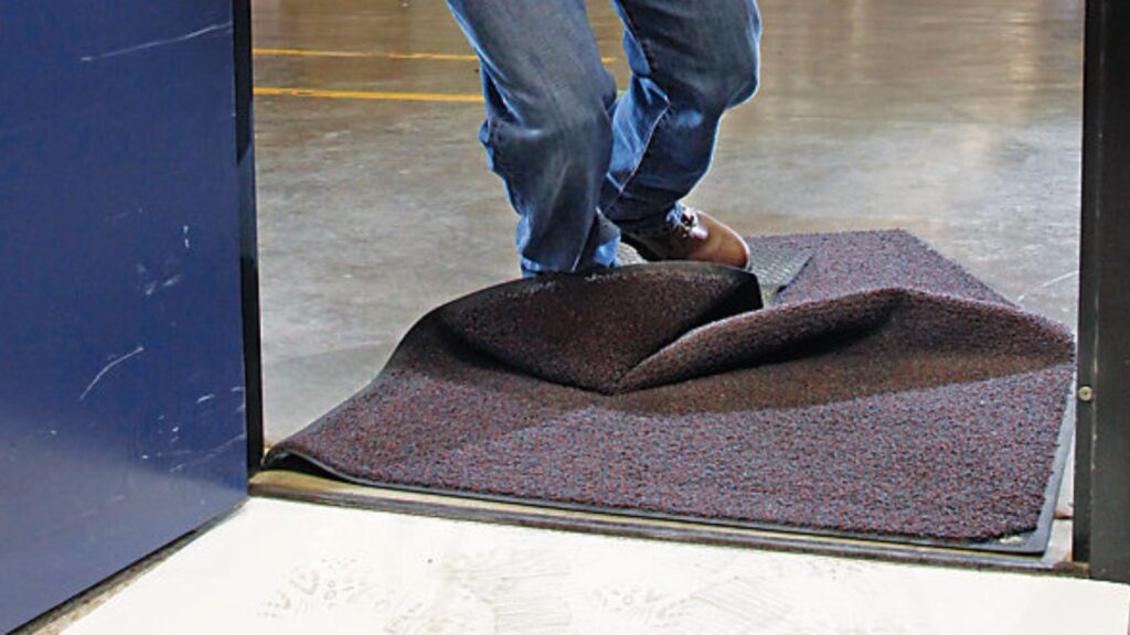 Carpet with visible ripples and buckling caused by loose fitting